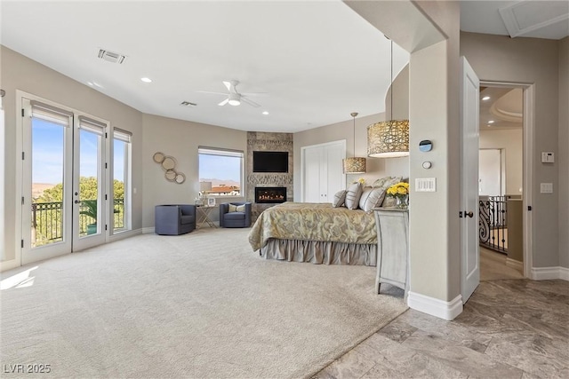 17 Grand Corniche Dr, Henderson, NV 89011 - bedroom featuring a large fireplace, baseboards, access to exterior, and visible vents