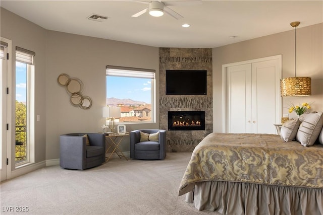 17 Grand Corniche Dr, Henderson, NV 89011 - bedroom featuring visible vents, carpet, access to outside, and a large fireplace