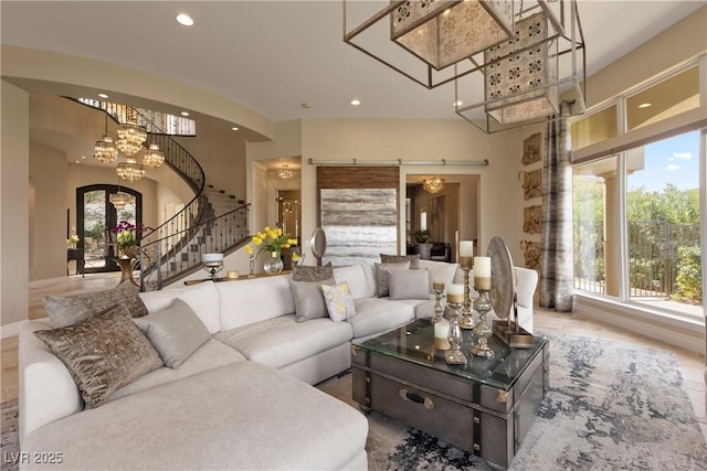 17 Grand Corniche Dr, Henderson, NV 89011 - living room featuring recessed lighting, stairway, and an inviting chandelier
