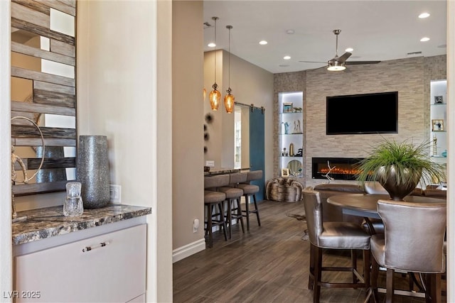 17 Grand Corniche Dr, Henderson, NV 89011 - interior space featuring dark wood-style flooring, baseboards, recessed lighting, a barn door, and a ceiling fan