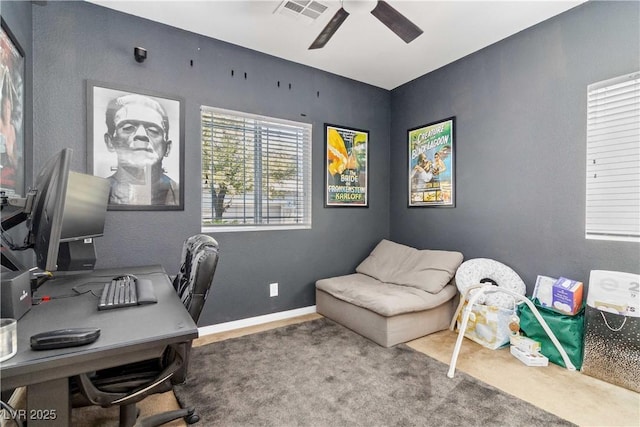 office area with carpet floors and ceiling fan
