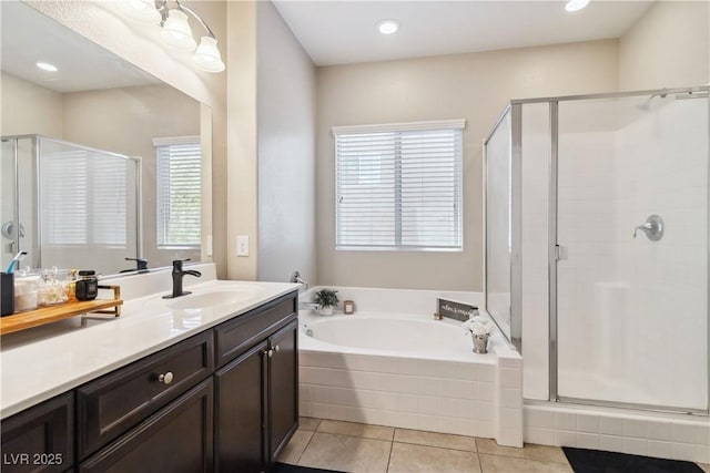 full bath with a shower stall, healthy amount of natural light, and a bath