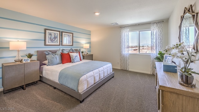 bedroom featuring carpet floors and baseboards