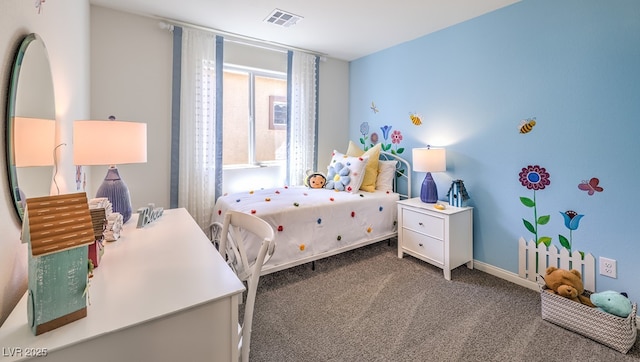carpeted bedroom featuring baseboards and visible vents