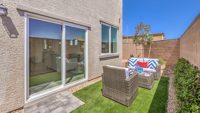 exterior space featuring a fenced backyard and an outdoor hangout area