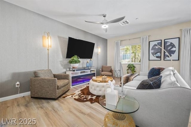 4465 Shimmering Skies St Unit 1177, North Las Vegas, NV 89031 - living area featuring a ceiling fan, baseboards, visible vents, and wood finished floors