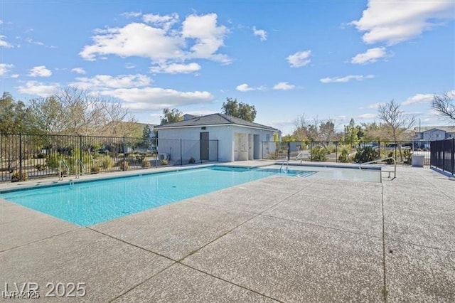 4465 Shimmering Skies St Unit 1177, North Las Vegas, NV 89031 - community pool with a patio and fence