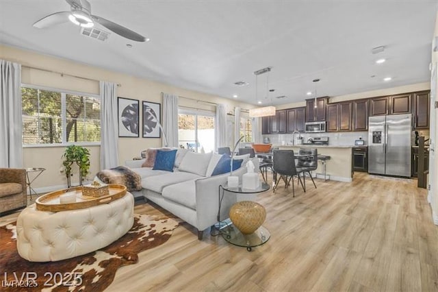 4465 Shimmering Skies St Unit 1177, North Las Vegas, NV 89031 - living area featuring visible vents, recessed lighting, light wood-style floors, and ceiling fan