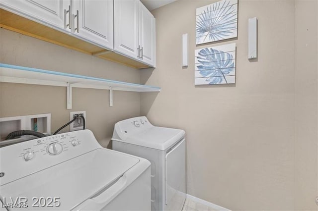 4465 Shimmering Skies St Unit 1177, North Las Vegas, NV 89031 - clothes washing area featuring baseboards, cabinet space, and washing machine and dryer