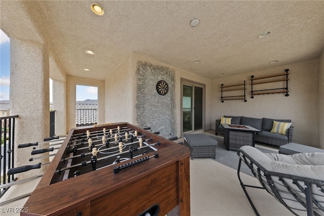 2606 Marvel Astoria St, Henderson, NV 89044 - view of patio with a balcony and an outdoor living space with a fire pit