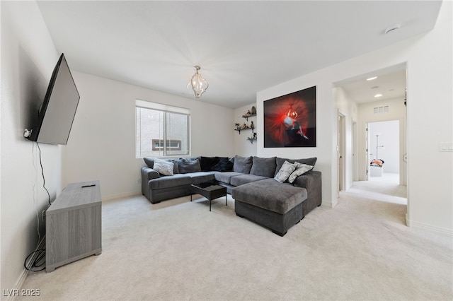 2606 Marvel Astoria St, Henderson, NV 89044 - living area featuring an inviting chandelier, baseboards, light carpet, and visible vents