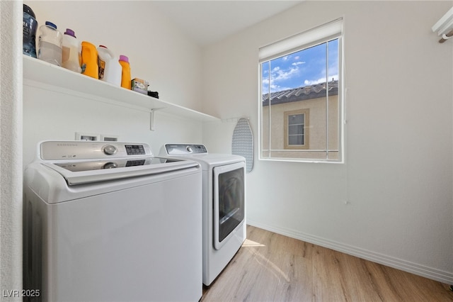 2606 Marvel Astoria St, Henderson, NV 89044 - clothes washing area with baseboards, laundry area, washing machine and dryer, and light wood finished floors