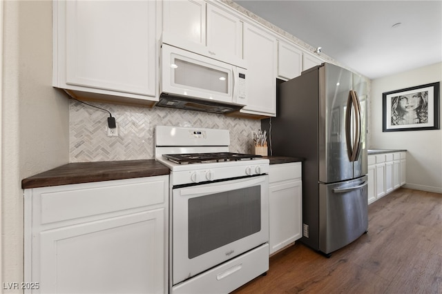 2606 Marvel Astoria St, Henderson, NV 89044 - kitchen featuring dark wood finished floors, backsplash, white appliances, and white cabinetry