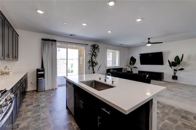 242 Polaris Ridge Ave, Henderson, NV 89011 - kitchen featuring a sink, stainless steel appliances, open floor plan, visible vents, and light countertops