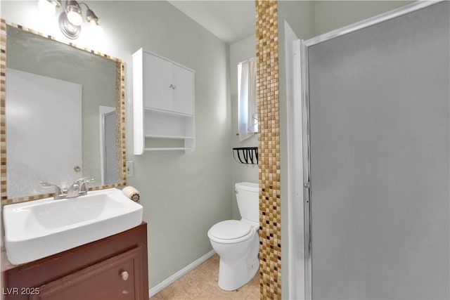 bathroom featuring toilet, an enclosed shower, tile patterned floors, and vanity