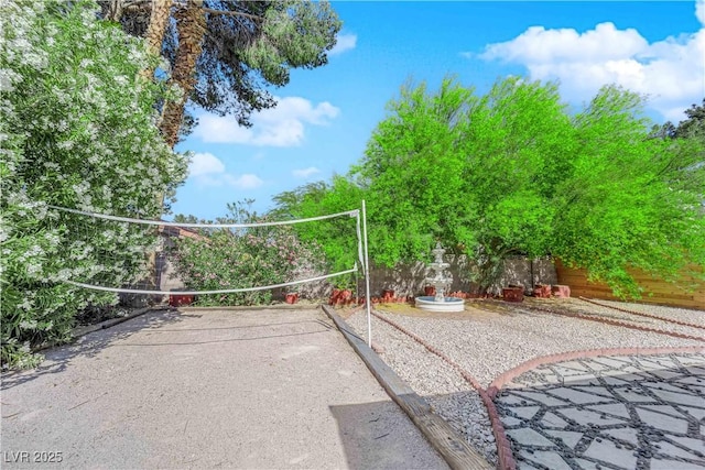 view of property's community featuring fence
