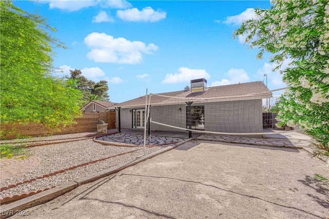 back of property featuring a patio area and a fenced backyard
