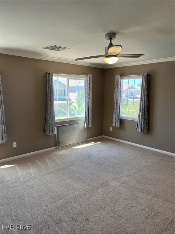 10974 Fintry Hills St, Las Vegas, NV 89141 - carpeted empty room with a healthy amount of sunlight, baseboards, ornamental molding, and a ceiling fan
