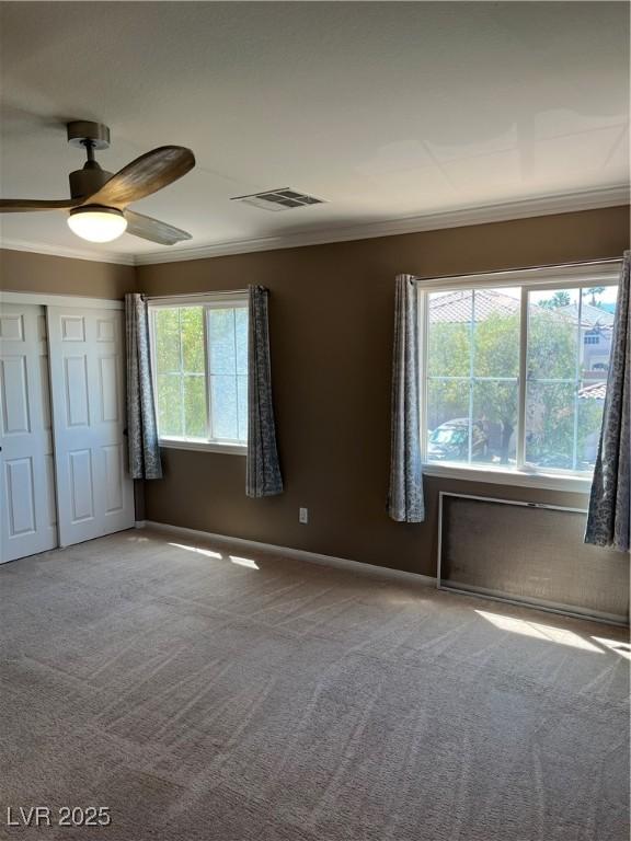 10974 Fintry Hills St, Las Vegas, NV 89141 - unfurnished bedroom featuring visible vents, ornamental molding, baseboards, and carpet floors