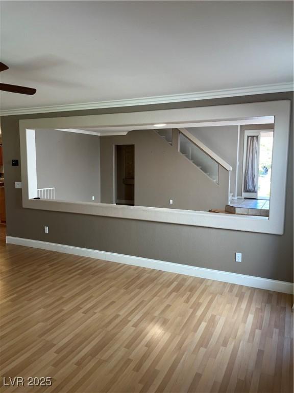 10974 Fintry Hills St, Las Vegas, NV 89141 - unfurnished room with baseboards, ceiling fan, ornamental molding, and wood finished floors