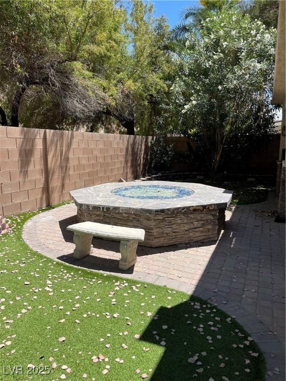 10974 Fintry Hills St, Las Vegas, NV 89141 - view of yard with a patio, an in ground hot tub, and fence