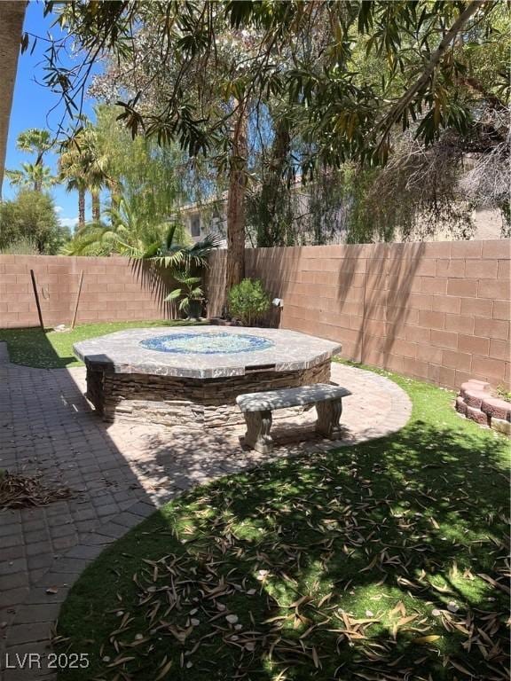 10974 Fintry Hills St, Las Vegas, NV 89141 - view of yard with a fenced backyard and a jacuzzi