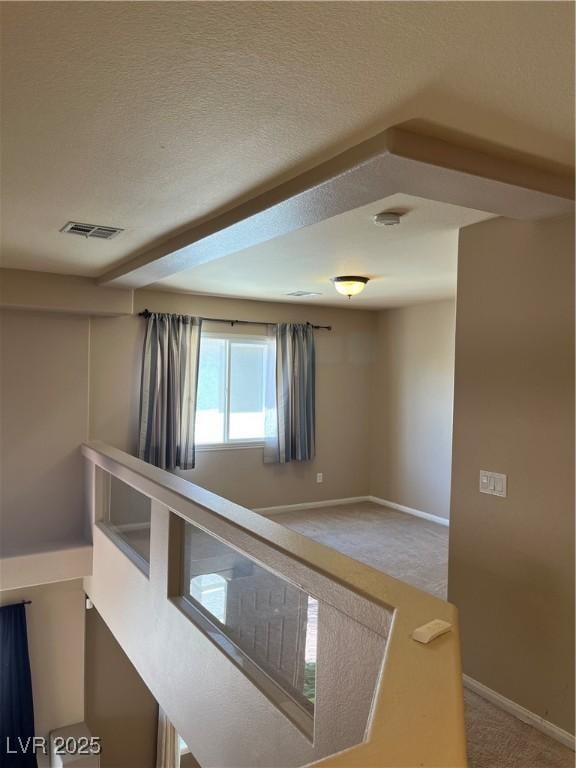 10974 Fintry Hills St, Las Vegas, NV 89141 - hallway with visible vents, carpet flooring, baseboards, and an upstairs landing