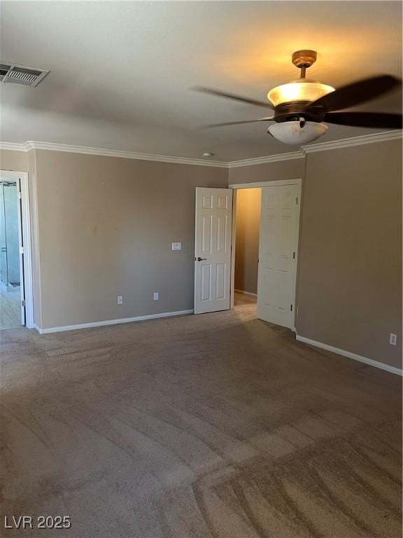 10974 Fintry Hills St, Las Vegas, NV 89141 - carpeted spare room with visible vents, ornamental molding, baseboards, and ceiling fan