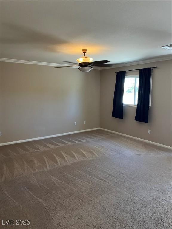 10974 Fintry Hills St, Las Vegas, NV 89141 - carpeted spare room with crown molding, a ceiling fan, baseboards, and visible vents