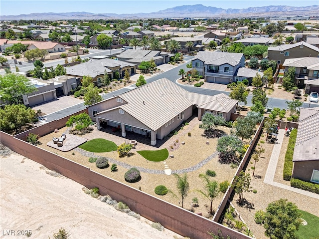 drone / aerial view with a residential view and a mountain view