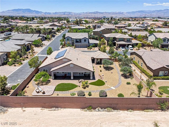 birds eye view of property with a mountain view and a residential view