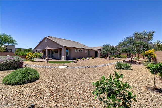 back of house with fence and a patio area
