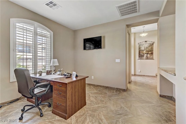 home office with visible vents and baseboards