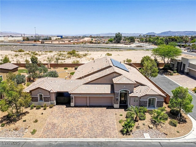 birds eye view of property with a mountain view