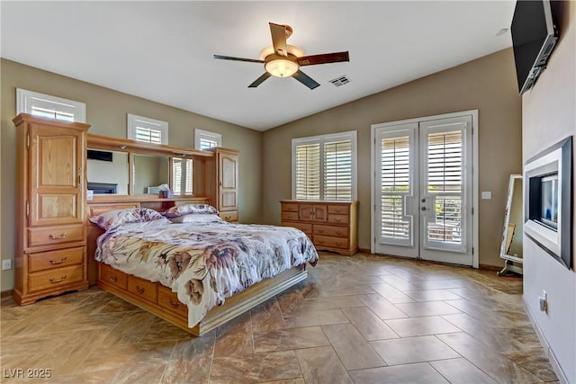 bedroom with access to outside, french doors, baseboards, lofted ceiling, and visible vents