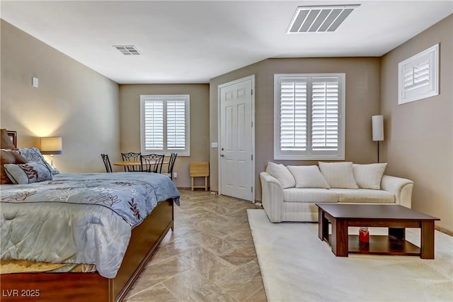 bedroom featuring visible vents
