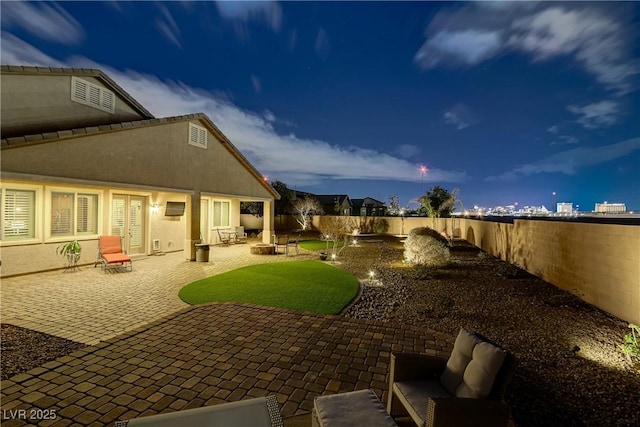 view of yard with a fenced backyard, an outdoor hangout area, and a patio area