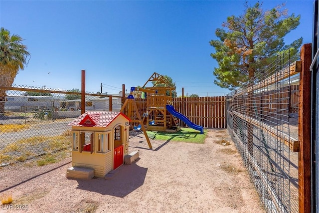 view of playground featuring fence