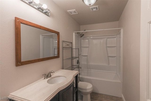 full bath with vanity, washtub / shower combination, toilet, and visible vents