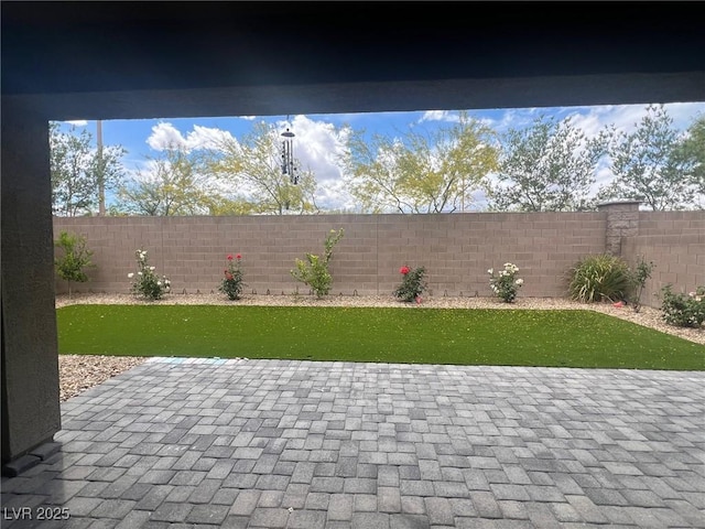 7527 Ardenno St, North Las Vegas, NV 89084 - view of yard with fence and a patio