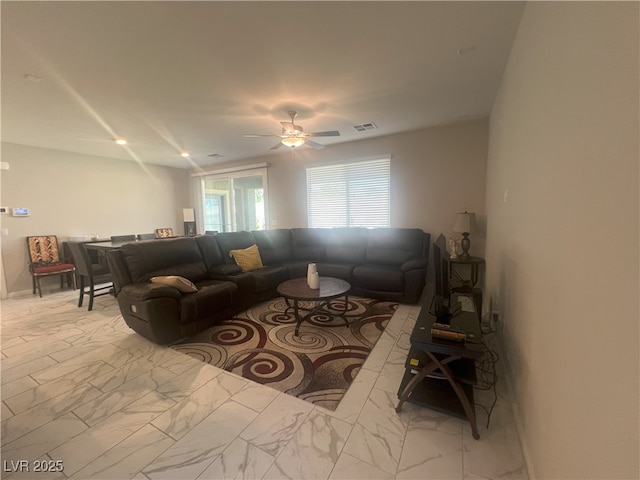 7527 Ardenno St, North Las Vegas, NV 89084 - living room featuring light marble finish floors and ceiling fan