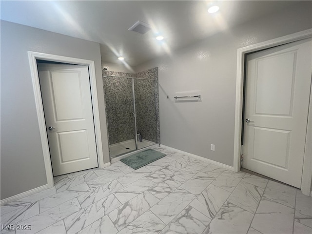 7527 Ardenno St, North Las Vegas, NV 89084 - bathroom featuring baseboards, marble finish floors, and a stall shower