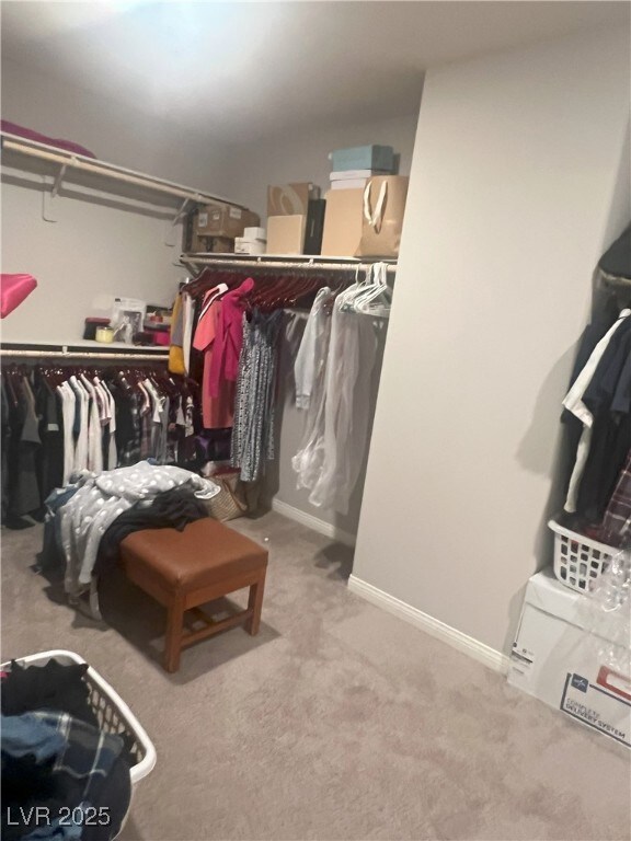 7527 Ardenno St, North Las Vegas, NV 89084 - spacious closet featuring carpet