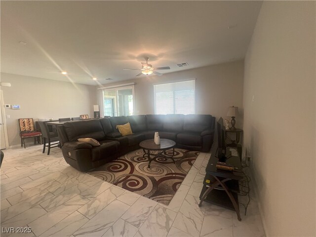 7527 Ardenno St, North Las Vegas, NV 89084 - living room with light marble finish flooring and ceiling fan