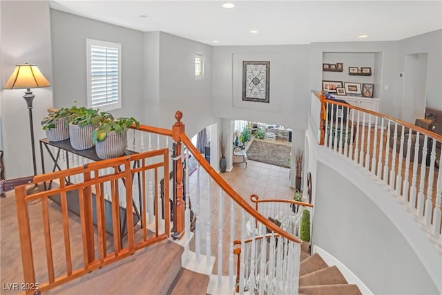 stairs featuring recessed lighting