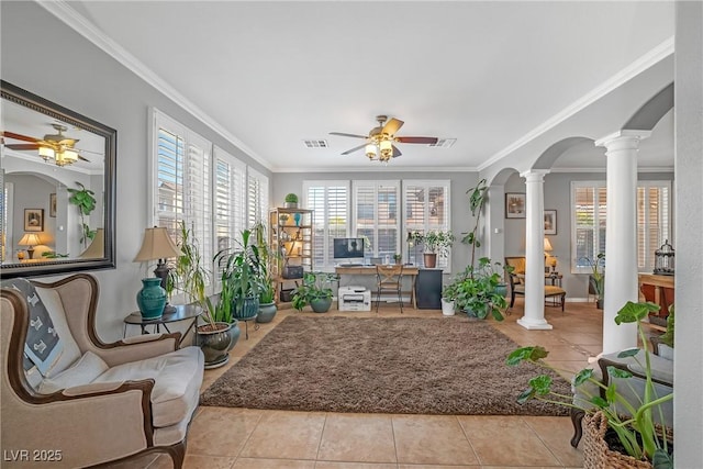 sunroom / solarium with visible vents, arched walkways, and a wealth of natural light