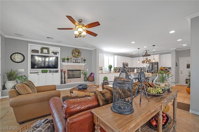 living area featuring visible vents, crown molding, light tile patterned flooring, recessed lighting, and a ceiling fan