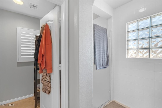 bathroom featuring visible vents and baseboards