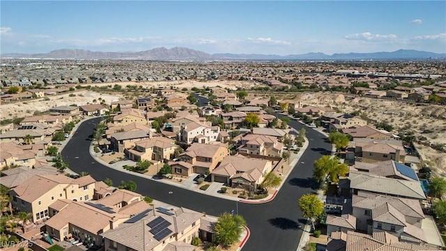 drone / aerial view featuring a residential view and a mountain view