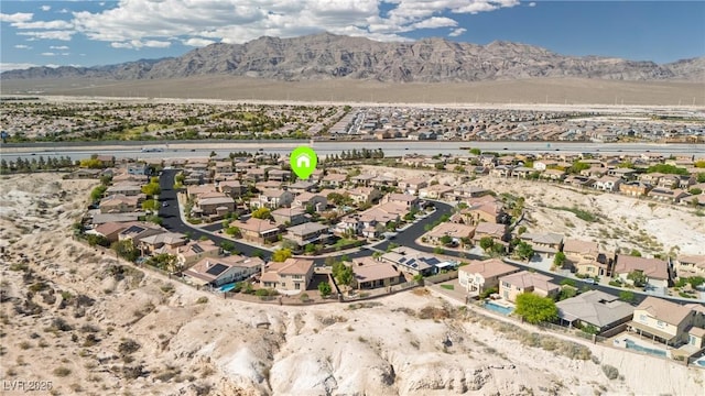 birds eye view of property with a residential view and a mountain view